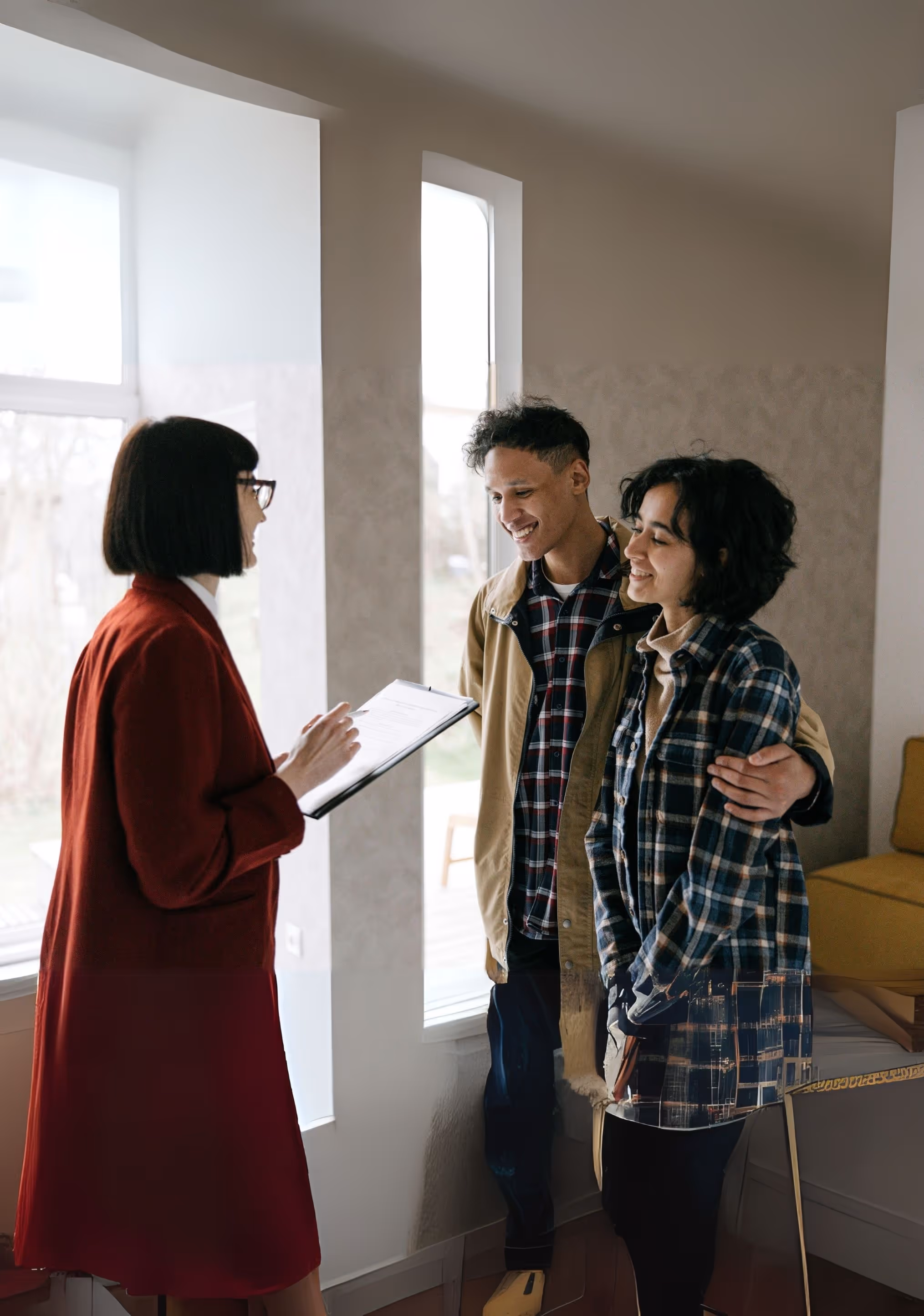 A loan officer meeting with a couple about a loan