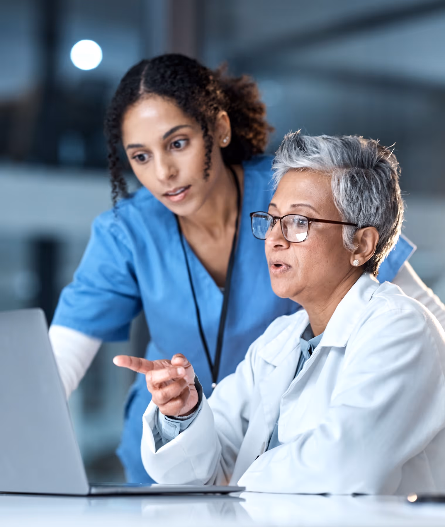 A nurse and a doctor reviewing information together