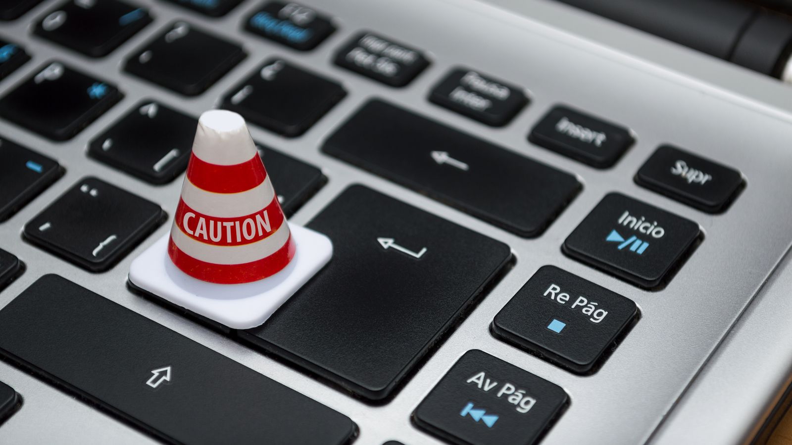 Caution cone on a laptop keyboard